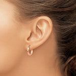 Kép betöltése a galériamegjelenítőbe: 14k Rose Gold Round Hoop Earrings on a Model