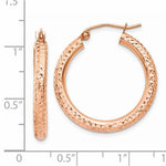 將圖片載入圖庫檢視器 14k Rose gold hoop earrings with textured design on a white background with measurement scale.
