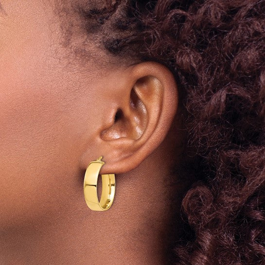 14K yellow gold hoop earrings 24mm x 7mm, angled view showing polished finish