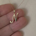 Load and play video in Gallery viewer, 10K Yellow Gold Script Initial Letter N Cursive Alphabet Pendant Charm
