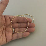 Load and play video in Gallery viewer, 14K Yellow Gold 55mm x 1.5mm Endless Round Hoop Earrings
