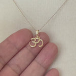 Load and play video in Gallery viewer, 14k Yellow Gold Om Symbol Open Back Pendant Charm
