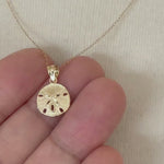 Load and play video in Gallery viewer, 14k Yellow Gold Small Sand Dollar Pendant Charm
