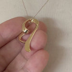 Load and play video in Gallery viewer, 14k Yellow Gold Floating Heart Chain Slide Pendant Charm
